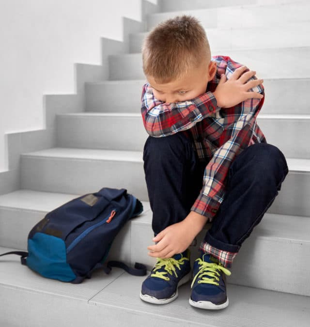 cropped-little-offended-school-boy-sitting-alone-on-stairs-2021-08-31-21-41-23-utc.jpg