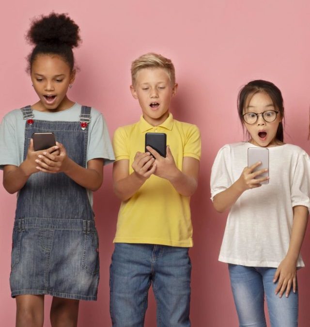 cropped-shocked-schoolkids-looking-into-their-mobile-phone-2021-08-29-02-26-10-utc-scaled-1.jpg