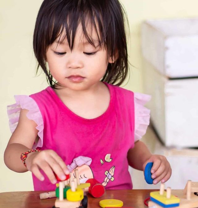 baby-girl-playing-the-wooden-block-toys-on-2021-09-04-04-11-38-utc