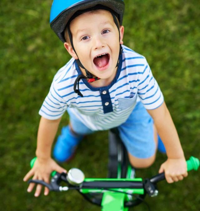 happy-3-year-old-boy-having-fun-riding-a-bike-2022-05-18-20-10-14-utc